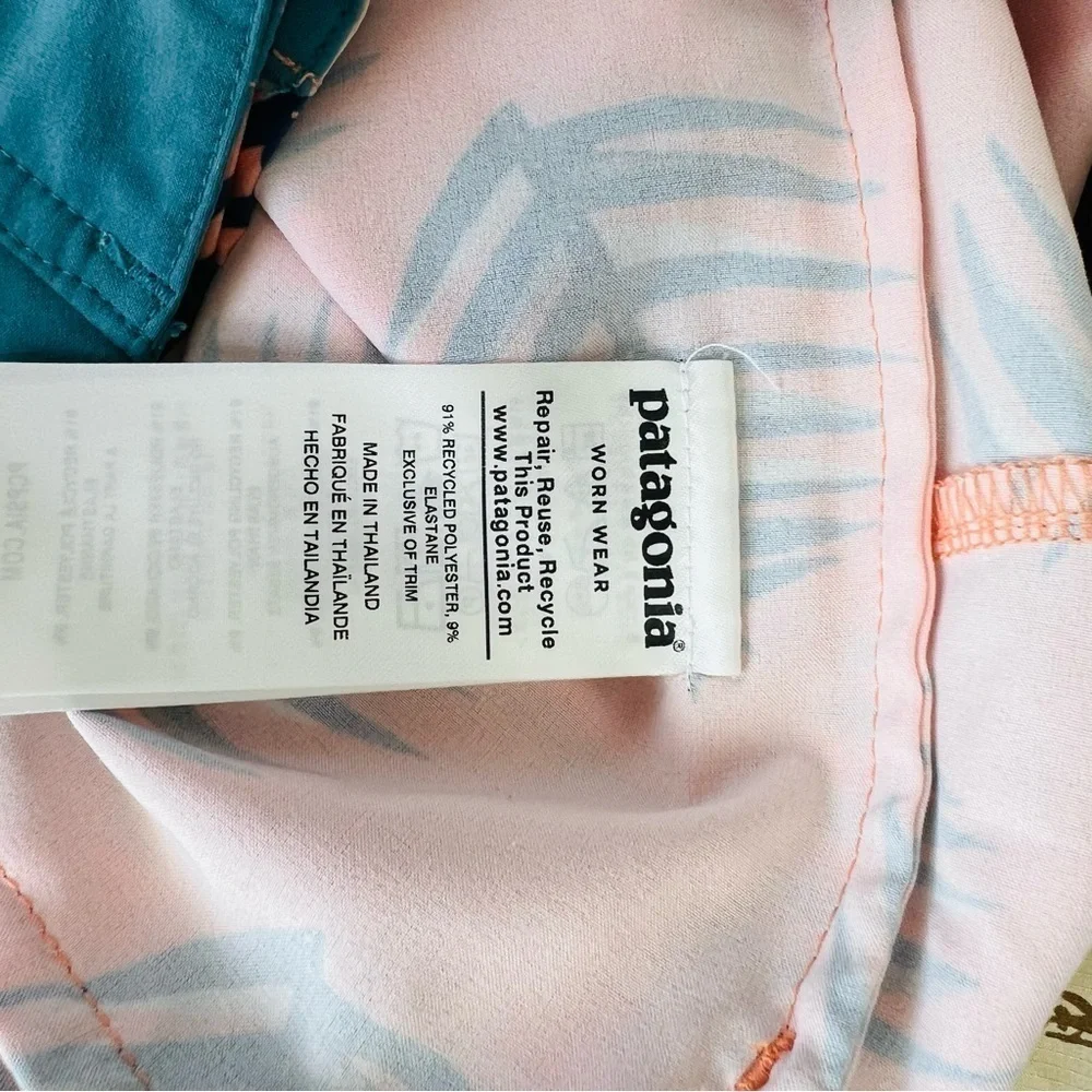 Patagonia Wavefarer boy shorts in coral palm leaves prints
